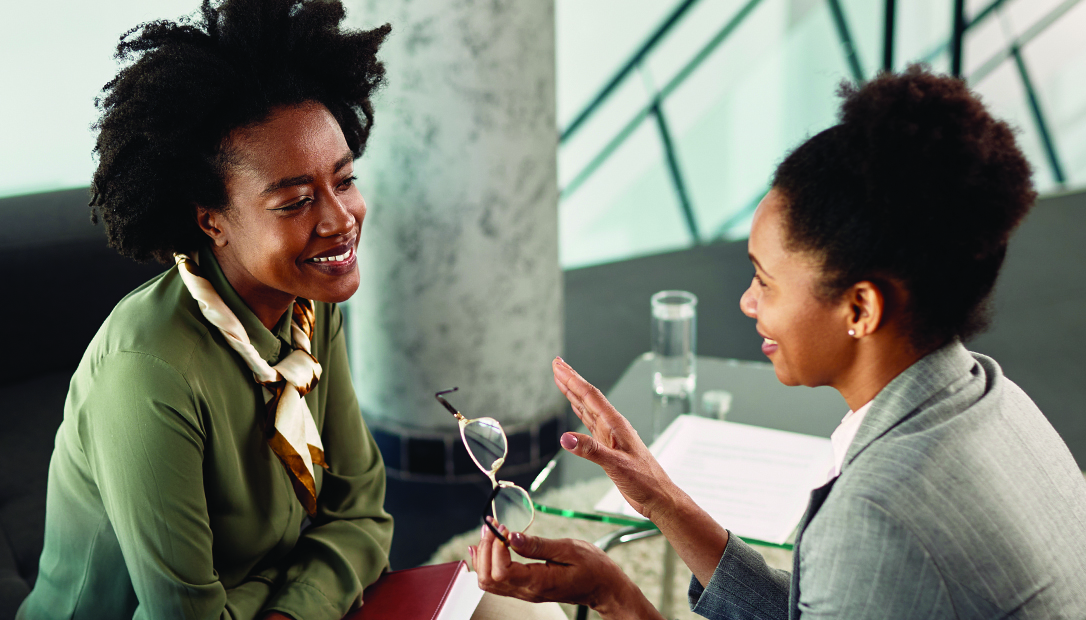 Associate discussing with her manager