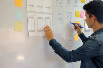 Person working on user story mapping