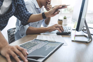 People working in front of laptop